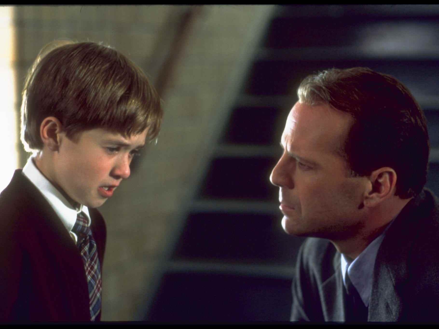 Haley Joel Osment und Bruce Willis in dem Film „The Sixth Sense“ von 1999.