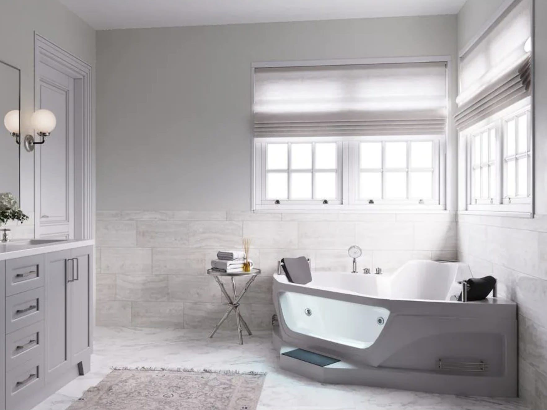 Die Ariel Eck-Whirlpool-Badewanne mit rechtem Abfluss, eine der besten Eckbadewannen im Jahr 2023, in einem weiß gefliesten Badezimmer mit Fenstern darüber.