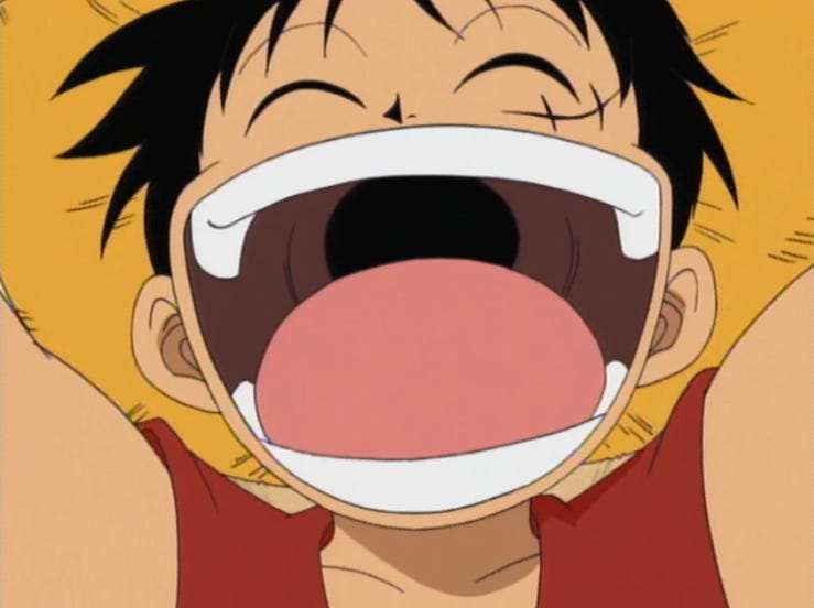 Ruffy im One-Piece-Anime, der wild lächelt und seine Arme ausstreckt