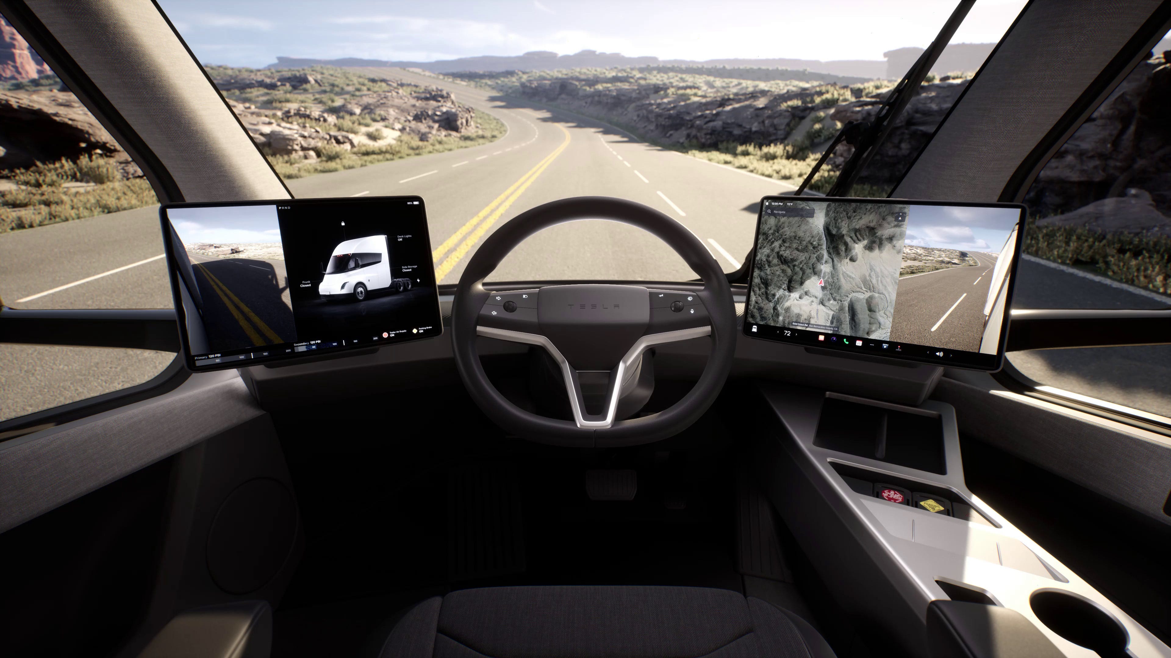 Der Innenraum eines Tesla Semi zeigt zwei Bildschirme auf beiden Seiten des Lenkrads, Knöpfe und Getränkehalter