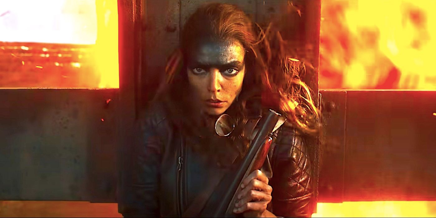 Anya Taylor-Joys Furiosa nutzt eine Metallwand, um sich vor einer feurigen Explosion zu schützen, während sie im Furiosa-Trailer eine Waffe in der Hand hält