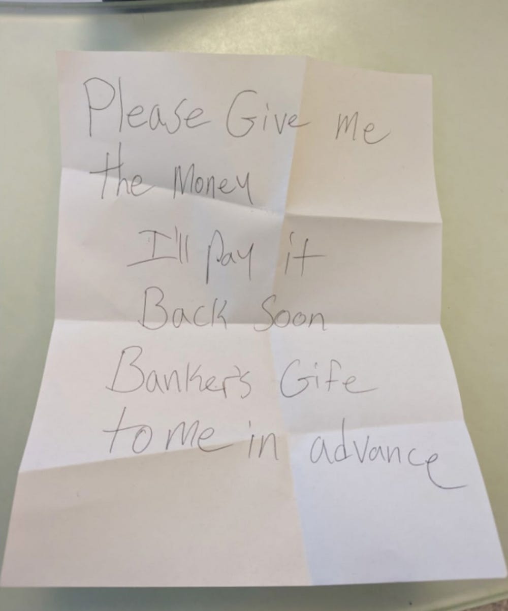 Eine Bleistiftnotiz auf weißem Papier, die angeblich von Mohamed Worku verfasst und am 22. Januar 2024 einem Mitarbeiter der Illinois Citi Bank gezeigt wurde, mit der Aufschrift: „Bitte geben Sie mir das Geld. Ich zahle es bald zurück. Der Banker zahlt mir im Voraus.“