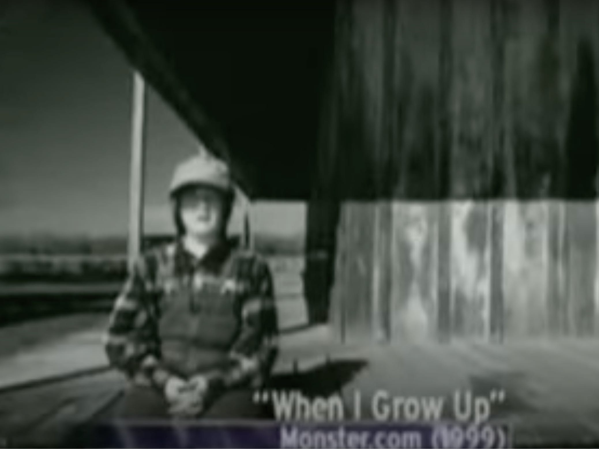 Junge sitzt draußen.  Im Text steht: „When I Grow Up“ Monster.com (1999).
