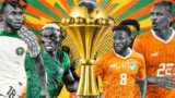 Eine farbenfrohe Grafik mit den nigerianischen Spielern Ademola Lookman und Victor Osimhen sowie den ivorischen Spielern Franck Kessie und Sebastien Haller auf beiden Seiten der Trophäe des Afrikanischen Nationen-Pokals