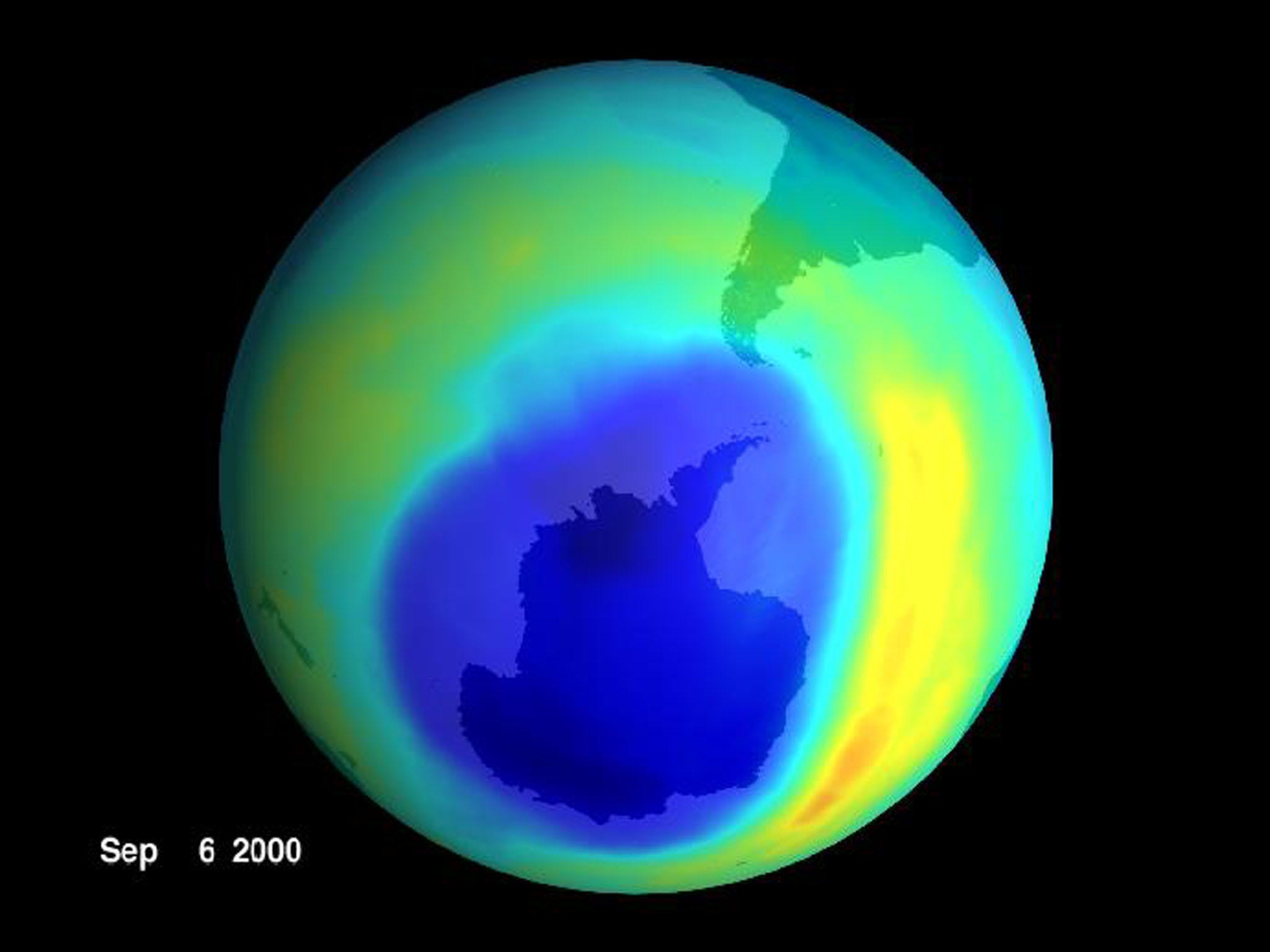 Die Ozonschicht ist in einer grünen globalen Erdansicht zu sehen, die die Antarktis mit einem riesigen blauen Fleck darüber zeigt