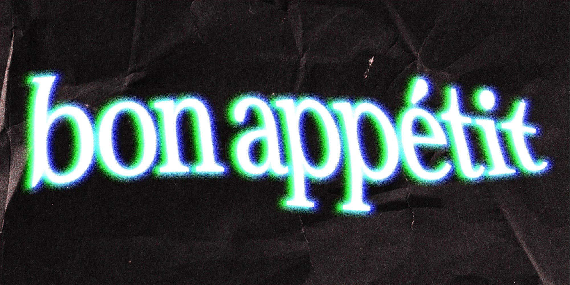 „Bon Appétit“ in grün-weißer Schrift auf schwarzem Hintergrund.