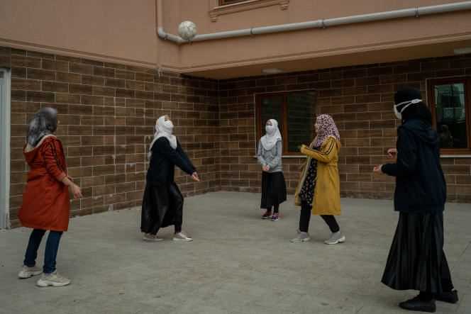 Students play volleyball in a courtyard at Oku Uygur Bilig boarding school near Istanbul on April 19.