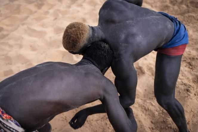 Senegalese wrestlers compete in a training session in Petit-Mbao, a suburb of Dakar, on March 29, 2021.
