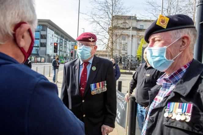 Military veterans protest outside Belfast, Northern Ireland court on April 26, 2021, ahead of the trial of two ex-soldiers accused of the murder of Joe McCann.