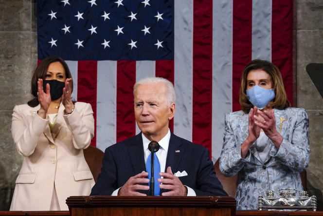 United States President Joe Biden surrounded by Vice President Kamala Harris and House of Representatives speaker Nancy Pelosi in Washington on April 29, 2021.