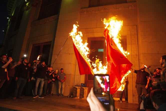 Demonstrators burn Turkish flags during the commemoration of the 106th anniversary of the Armenian genocide, in Yerevan, Armenia, on April 24.