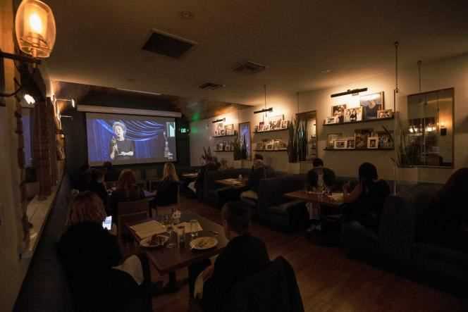Restaurant patrons watch the Oscars ceremony Sunday, April 25, in Los Angeles.