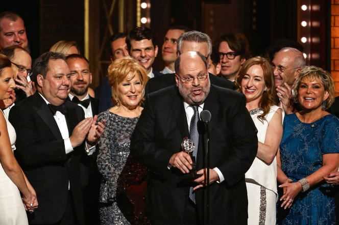 Scott Rudin, surrounded by the troupe of the musical 