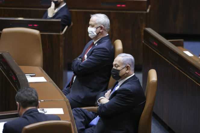 Israeli Prime Minister Benjamin Netanyahu, right, Defense Minister Benny Gantz, center, at the swearing-in ceremony of Israel's 24th government at the Knesset, Jerusalem, April 6, 2021.