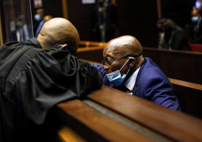 Former South African President Jacob Zuma (right) speaks with one of his lawyers at the Pietermaritzburg court on May 17, 2021.