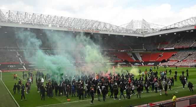 Manchester United supporters on the lawn at Old Trafford Stadium on May 2, 2021.
