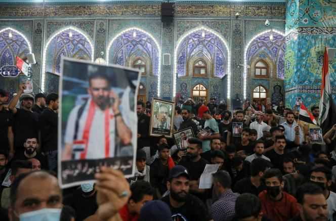 A crowd gathered for Ehab al-Wazni's funeral in Kerbala, Iraq, Sunday May 9.
