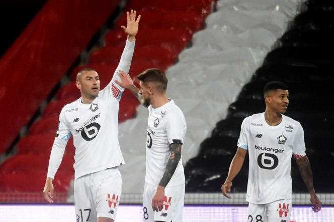 Burak Yilmaz celebrates his double scored against Lens at the Bollaert stadium, on May 7, 2021