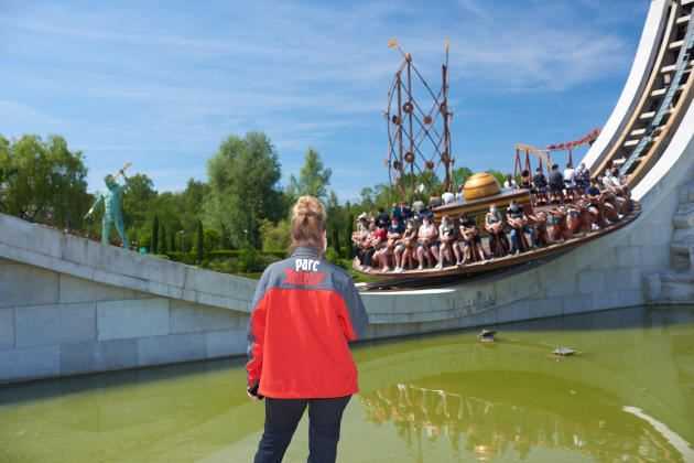 An employee of Parc Astérix monitors visitors in an attraction on June 9, 2021, the day of the reopening.