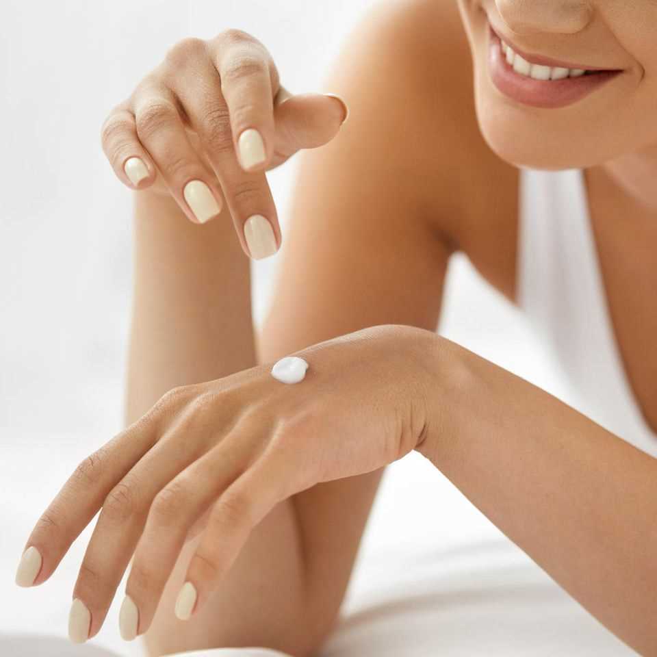 Hand care, well-groomed hands, hand cream, happy woman