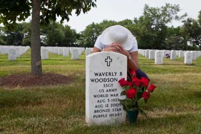 Joann Woodson, at the grave of her husband, Waverly B. Woodson Jr. (August 3, 1922 - August 12, 2005), in Arlington Military Cemetery, Virginia.