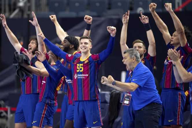 Barcelona players celebrate their victory in the Handball Champions League final against Aalborg, in Cologne, Germany on Sunday, June 13, 2021.