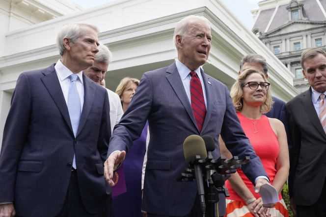 President Joe Biden, surrounded by senators from both sides, in front of the White House, before their meeting to discuss an infrastructure plan, June 24, 2021.