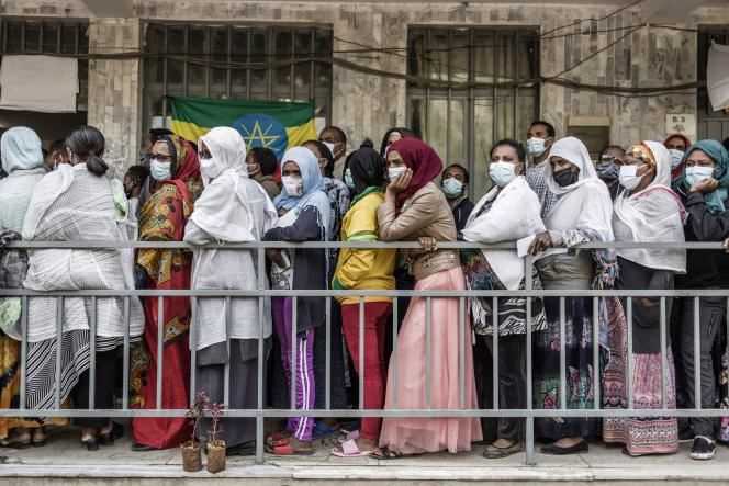 Ethiopian voters line up outside a polling station in Addis Ababa on June 21, 2021.