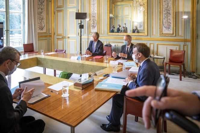 Emmanuel Macron receives Olivier Blanchard and Jean Tirole, co-chairs of the committee of experts on “The great economic challenges”, at the Elysée Palace in Paris, on June 23.