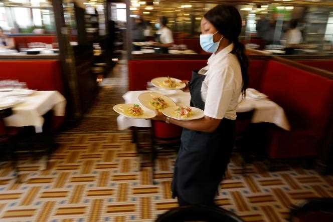 A waitress in a Parisian restaurant, in June 2021.
