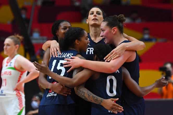 The French players celebrate their victory after winning the women's Euro basketball semi-final match against Belarus on June 26, 2021 in Valencia.