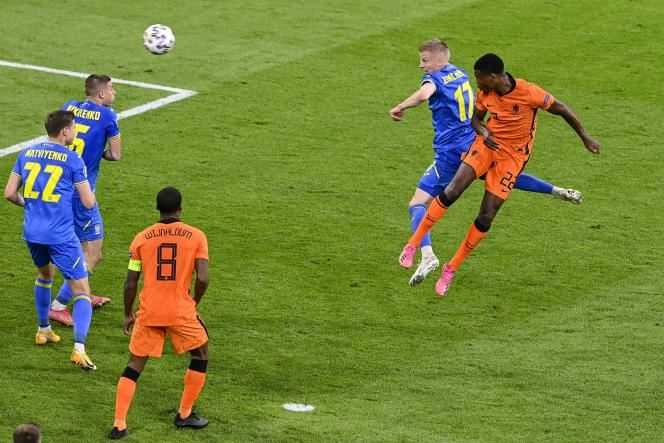 Denzel Dumfries jumps higher than his opponent to give the Netherlands victory over Ukraine on Sunday June 13 in Amsterdam.
