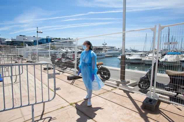 A laboratory worker in charge of carrying out screening tests near the Palais des Festivals in Cannes on June 26.