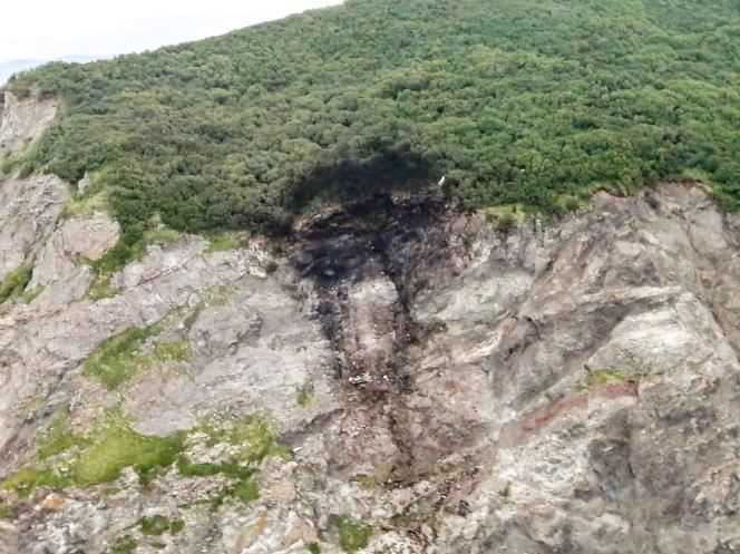 The trace of the Antonov An-26 plane crash on a cliff near the airport in the city of Palana, in the Far East region.  Photograph taken by the services of the Russian Ministry of Emergency Situations, July 7, 2021.