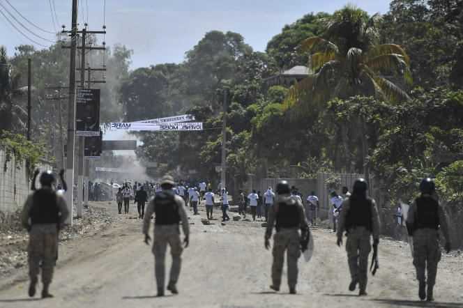 Supporters of Jovenel Moïse are prevented from attending the funeral by the police in Cap-Haitien, July 23, 2021.