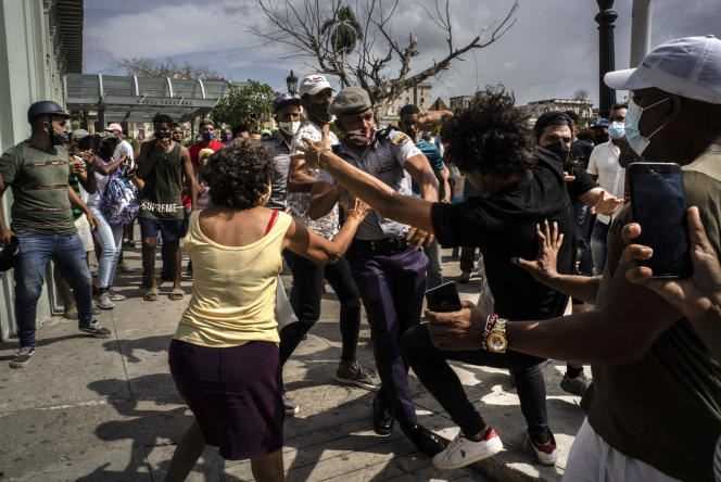 A clash between a policeman and a protester in Havana, July 11, 2021. Hundreds of protesters took to the streets of several cities in Cuba this day.