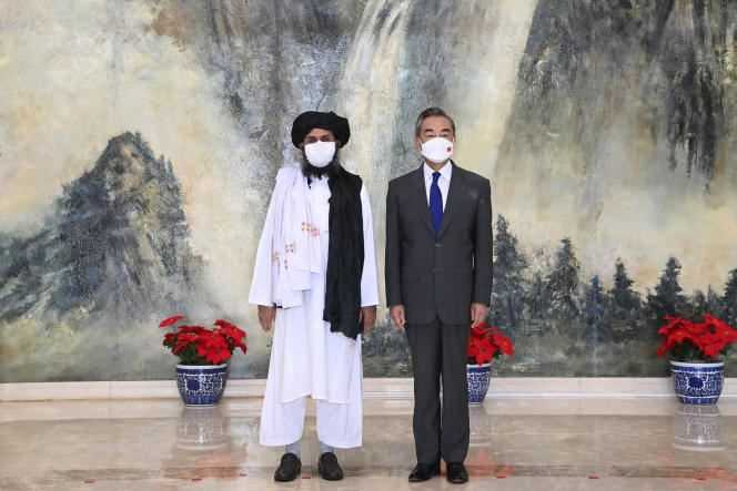 Mullah Abdul Ghani Baradar and Chinese Foreign Minister Wang Yi during their meeting in Tianjin, China on July 28, 2021.