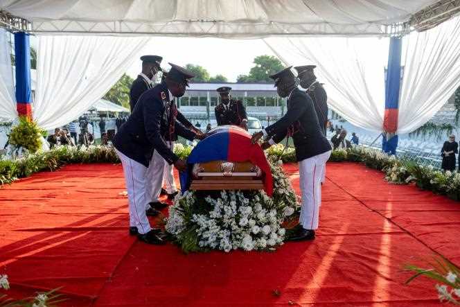 The national flag is placed on the coffin of Jovenel Moise, during the national funeral of the Haitian president, on July 23, 2021.