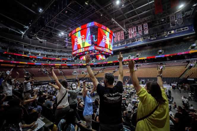 The crowd celebrates the number of doses of vaccines given at the Scotiabank Stadium, transformed into a vaccination center, in Toronto on June 27, 2021.