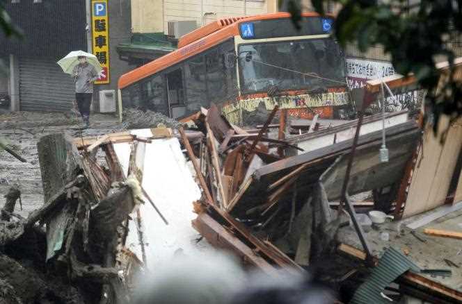 Mudslides damaged buses and homes in Atami, central Japan, Saturday, July 3, 2021.