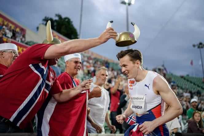 Karsten Warholm receives a Viking helmet from a supporter in Oslo on Thursday July 1.