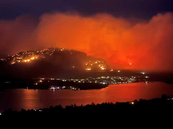 A wildfire, seen from the Highway 3 lookout near the town of Osoyoos, British Columbia, Canada, July 20, 2021.