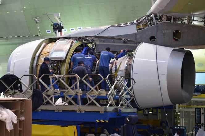 Airbus workers inspect an aircraft engine on March 20, 2018, in Blagnac, near Toulouse.