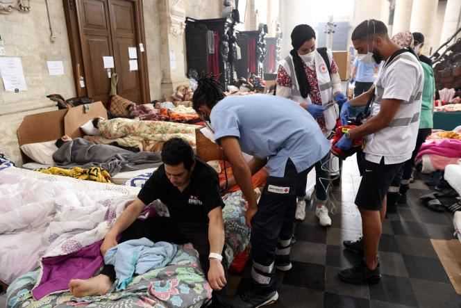 Doctors take care of undocumented migrants on hunger strike in the Saint-Jean-Baptiste-au-Béguinage church in Brussels on July 19, 2021.