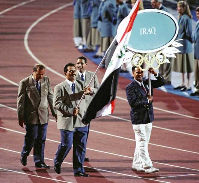 Athlete Raed Ahamed carrying the Iraq flag during the opening ceremony of the Olympic Games in Atlanta, United States, July 19, 1996.