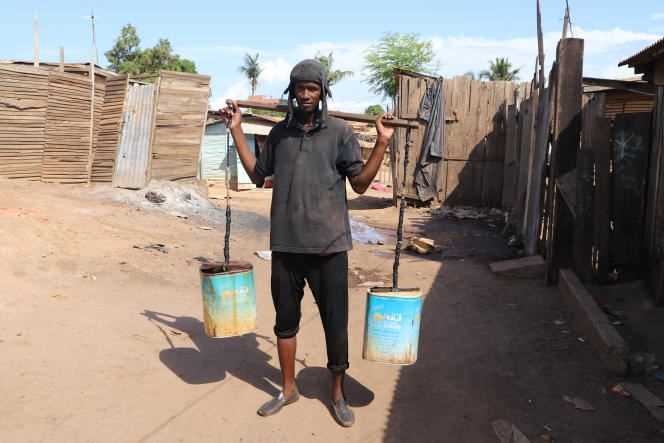 A water carrier in the Bardot slum in San Pedro.
