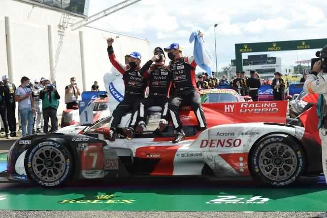 Mike Conway, Kazuki Nakajima and José Maria Lopez celebrate their victory at the 24 Hours of Le Mans on August 22.