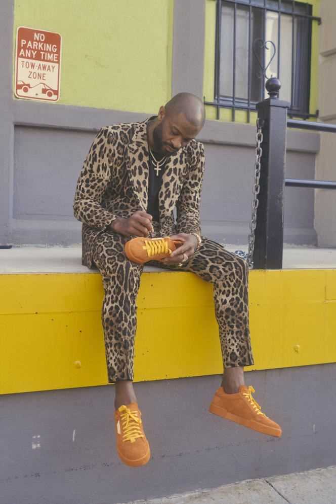 Miami Heats player PJ Tucker signs a pair of sneakers in collaboration with Dolce & Gabbana.
