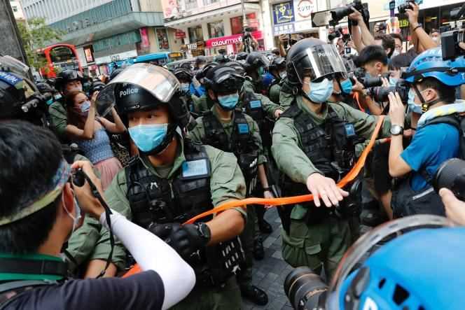 Police disperse pro-democracy protesters during a rally against the postponement of elections in Hong Kong in September 2020.