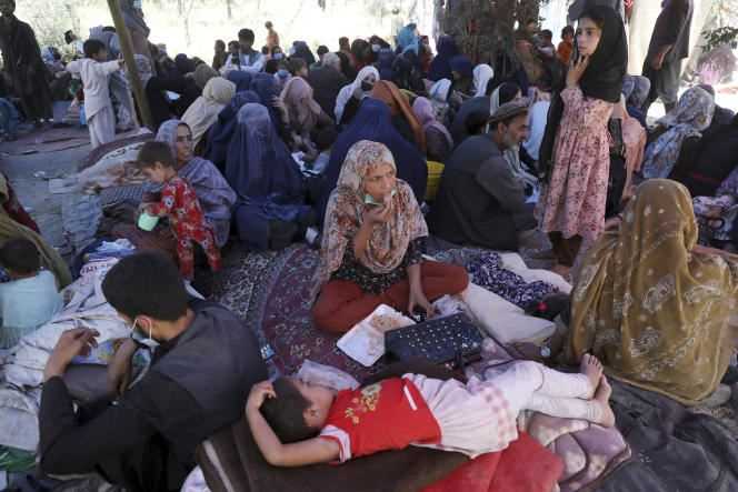 Afghan civilians, who fled the north of their country, gather in a public park in Kabul on August 10.  The decisions of Germany and the Netherlands come as fighting between the Afghan army and the Taliban has displaced thousands of people across Afghanistan.